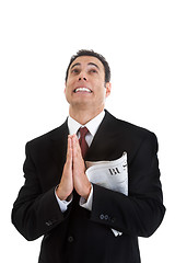 Image showing Businessman Holding Business Section Newspaper Looking Up Prayin