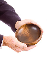 Image showing Old White Man Hands Holding Wooden Bowl Isolated