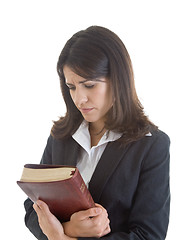 Image showing Worried Caucasian Woman Holding Bible Looking Down Praying White