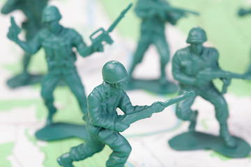 Image showing Plastic Army Men Fighting on Topographic Map Squad Attacks