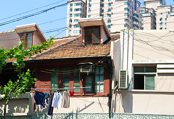 Image showing Old Home Laundry and Wires Contrast New Apartment Homes Shanghai