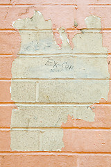 Image showing XXXL Paint Peeling Off Grungy Beige Brick Wall Grafitti Cop