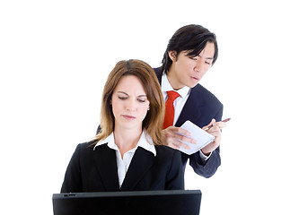 Image showing Asian Man Looking Over Shoulder Surfing, Copying,  Caucasian Wom