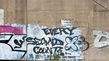 Image showing Every Second Counts Graffiti on Cement Wall