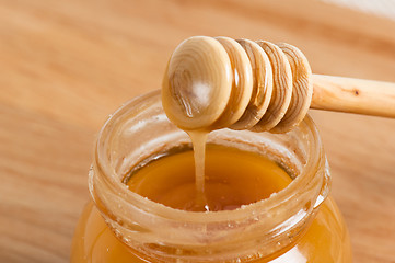 Image showing fresh gold honey dipper