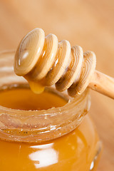 Image showing fresh gold honey dipper