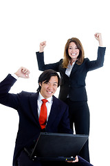 Image showing Happy Business Team, Asian Man Caucasian Woman Cheering at Lapto