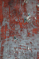 Image showing XXXL Grungy Wooden Wall with Peeling Paint and Paper Scraps