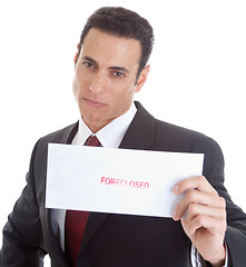 Image showing Serious Caucasian Man Holding a Foreclosure Notice, White Backgr