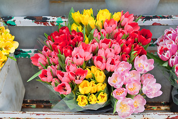 Image showing Bouquet of Flowers Tulips in a Old Metal Flourist Display 