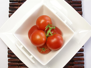 Image showing Small tomatoes in a chinaware