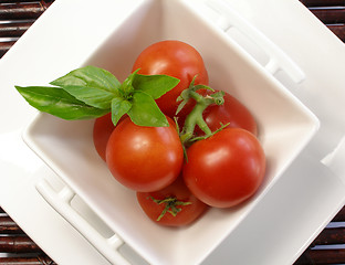 Image showing Small tomatoes with basil 2