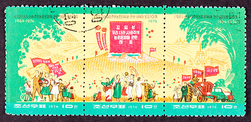 Image showing North Korean Postage Stamp Farmers Dancing Grain Piles Tractors