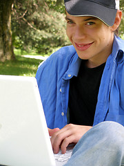 Image showing Teenager outside happy with a laptop closeup