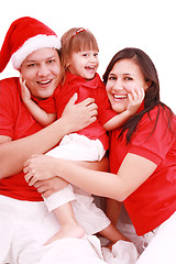 Image showing Portrait of happy family looking at camera and prepared for Chri