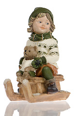 Image showing Miniature of child on sleigh