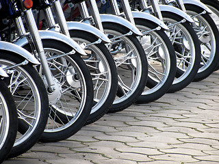 Image showing row of  wheels
