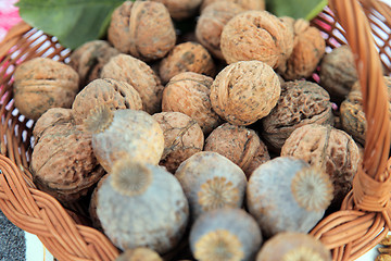 Image showing A pile of walnuts and poppy