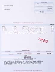 Image showing Paper Medical Bill CT Scan Stamped PAID Past Due