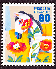 Image showing Canceled Japanese Postage Stamp Tulip Flower Covered Hobby Horse