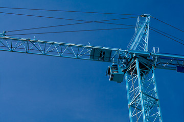 Image showing Construction Crane Isolated Against Blue Sky 