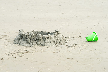 Image showing Drip Sand Castle on Beach With a Bucket