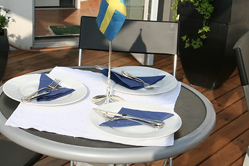 Image showing Table for three