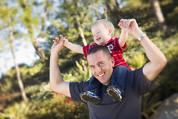 Image showing Young Laughing Father and Child Piggy Back