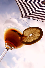 Image showing Summer cocktail. Martini and beach umbrella