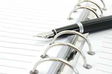 Image showing business organizer and pen