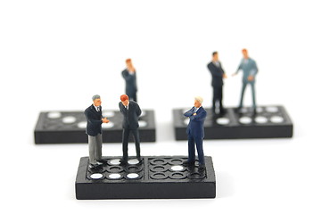 Image showing business man on domino 