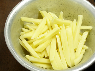 Image showing Bowl of raw french fries