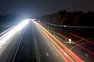 Image showing road with car traffic at night with blurry lights