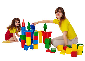 Image showing Happy mother and daughter playing with blocks