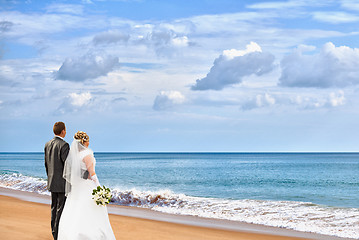 Image showing Bride and groom on the beach