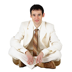 Image showing Business man sitting on a white