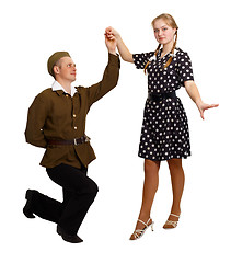 Image showing Pair perform a dance in the costumes of the 60s