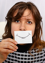 Image showing Tired woman smiles as may