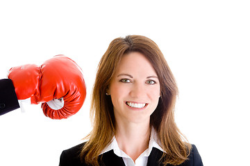 Image showing Smiling White Woman Unaware About to be Punched by Boxing Glove 