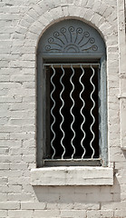 Image showing Window with Decorative Bars and Sunrise