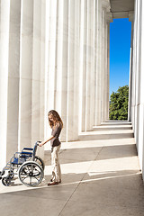 Image showing Woman Lincoln Memorial Columns Empty Wheelchair DC