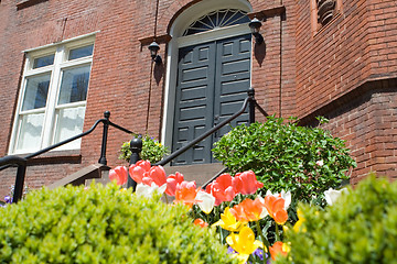 Image showing Brick Richardsonian Romanesque Row Home Spring