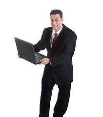 Image showing Angry Businessman Holding Laptop Isolated White Background Might