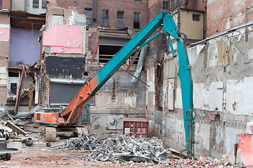 Image showing Demolition Equipment Knocking Down Building Collecting Scrap Met