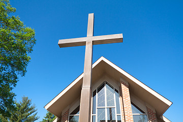 Image showing Tall Cross with Modern Church in Background
