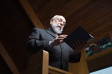 Image showing Looking Up at Senior Man Singing Hymn Church Pew