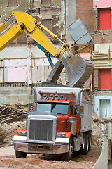 Image showing Front End Loader Dropping Scrap Materials Dump 