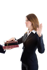 Image showing Caucasian Businesswoman Swearing on a Stack of Bibles White Isol