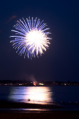 Image showing Purple Fireworks Over the Ocean