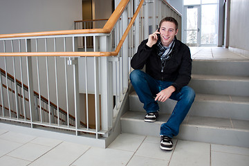 Image showing Man Talking on His Cell Phone in the Stairwell